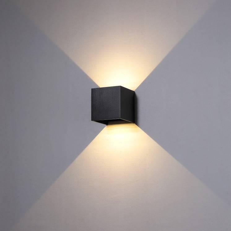 black up and down outdoor wall light show fitted on a white wall 