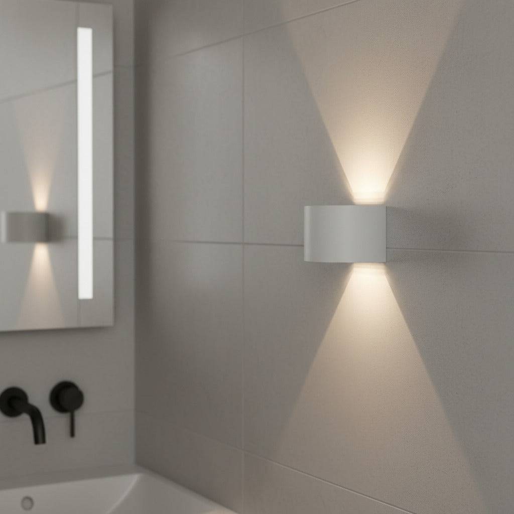 white wall mount bathroom light fixture mounted on the wall in a modern neutral bathroom