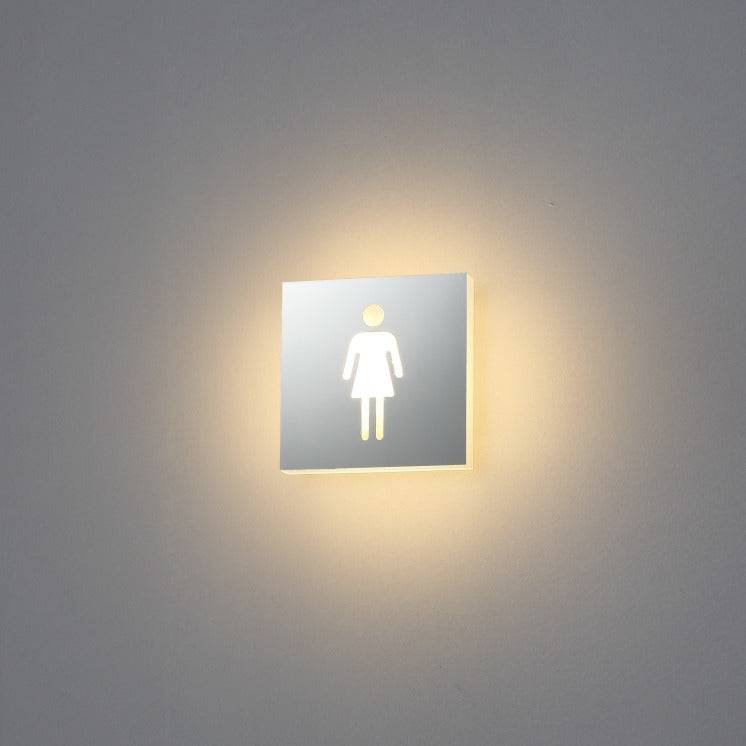 LED female toilet sign mounted on a white wall 