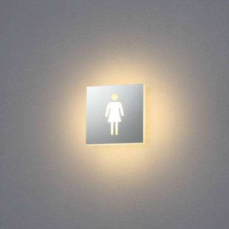 LED female toilet sign mounted on a white wall 