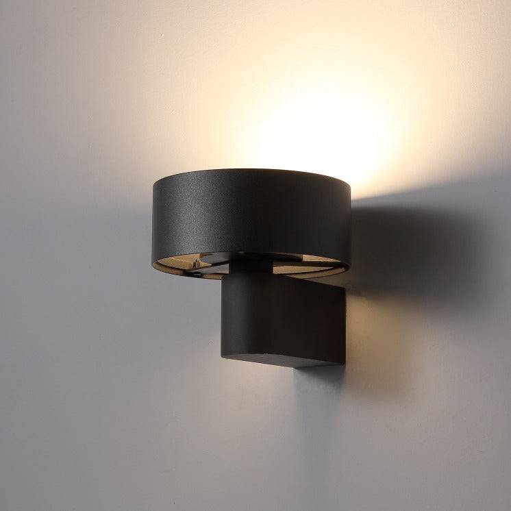 Black  wall mounted interior light fixture on a pale grey background