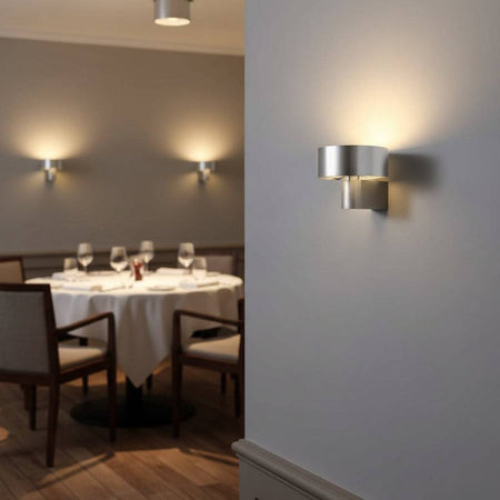 Silver interior lantern wall sconce in a restaurant shown as three on two walls