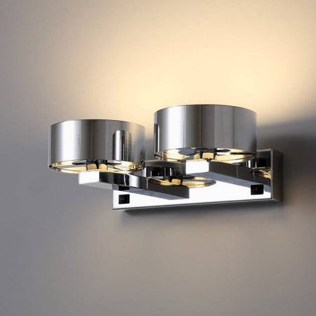 Polished chrome over bed reading light installed on a white wall