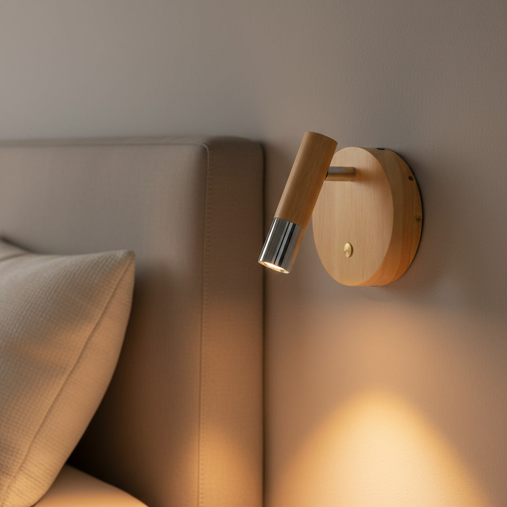 chrome adjustable wooden reading light mounted next to a bed