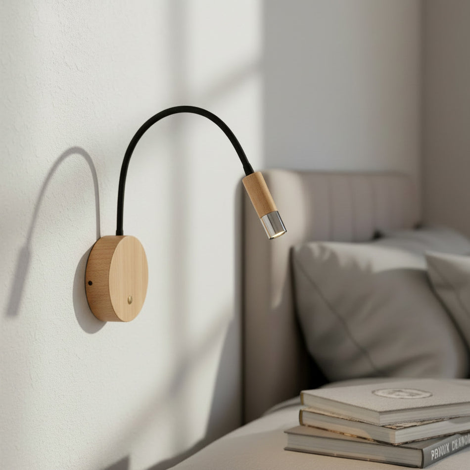 chrome flexible wooden reading light mounted next to a bed in a modern bedroom