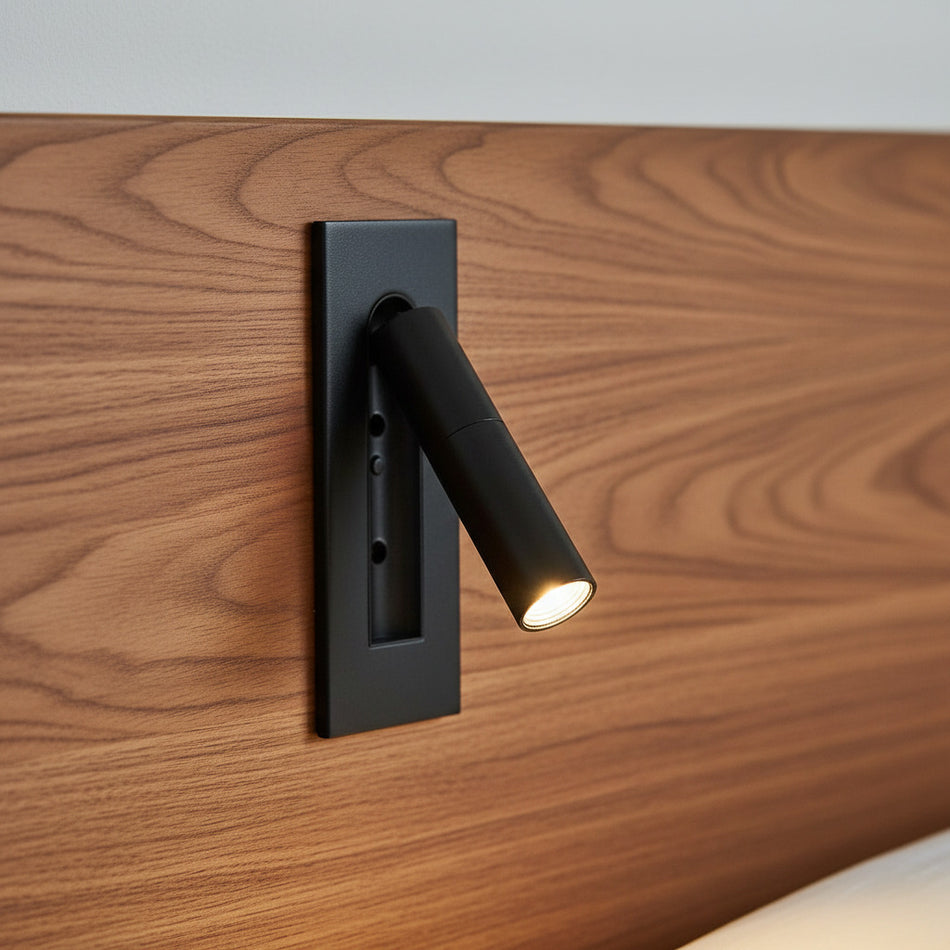 black recessed adjustable LED reading wall light mounted in a wooden headboard