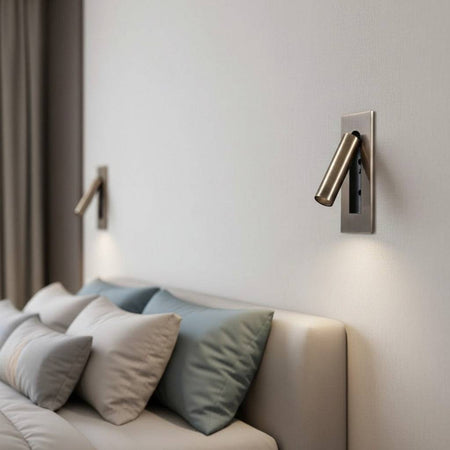 brushed copper recessed bedroom reading light with 2 lights mounted either side of a bed on the wall above the bed 