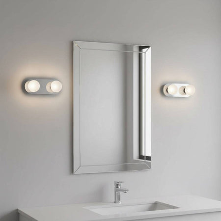 LED vanity wall light mounted either side of a mirror in a modern bathroom 