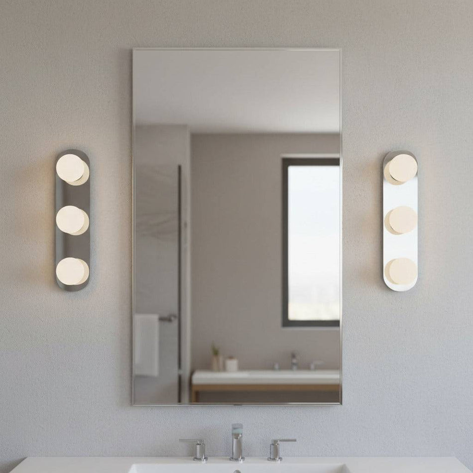 bathroom mirror wall light mounted either side of a mirror in a modern bathroom