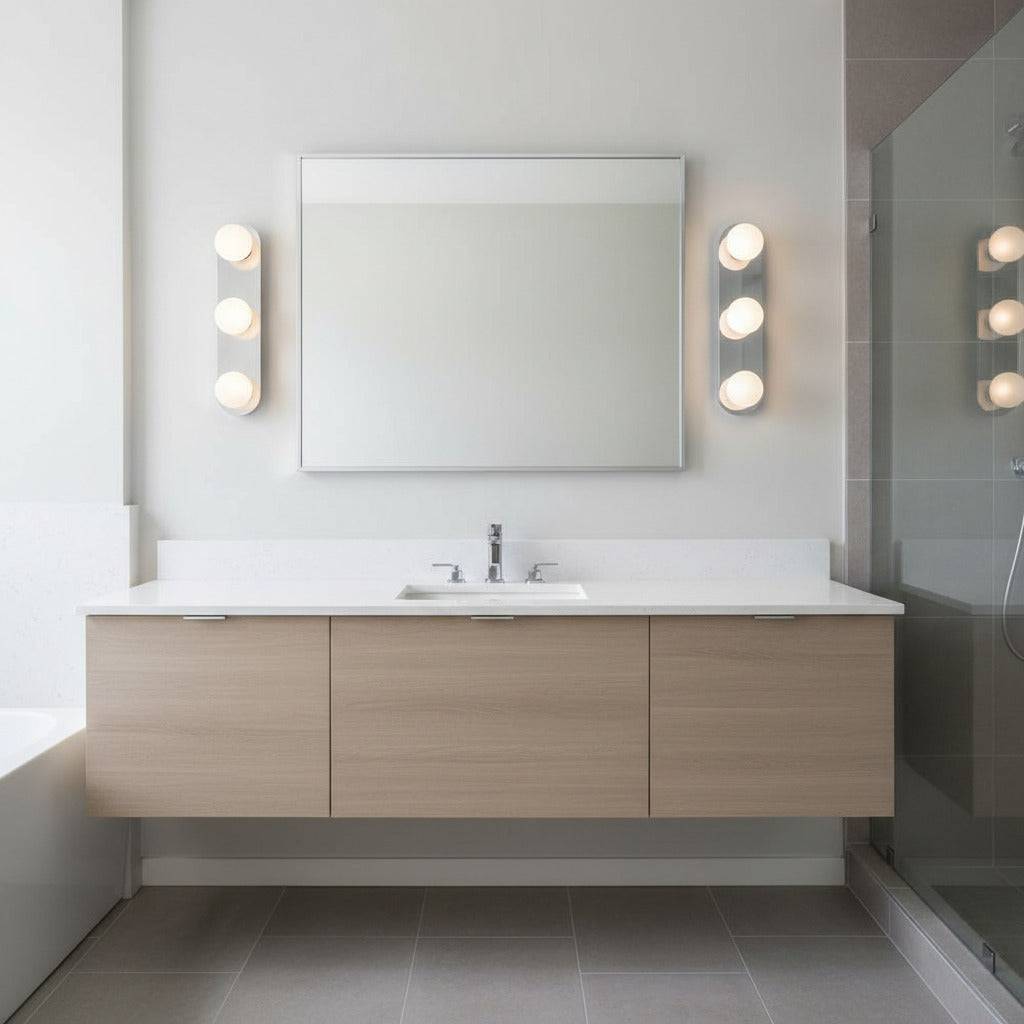 bathroom mirror wall light  mounted on each side of a mirror in a neutral coloured bathroom 