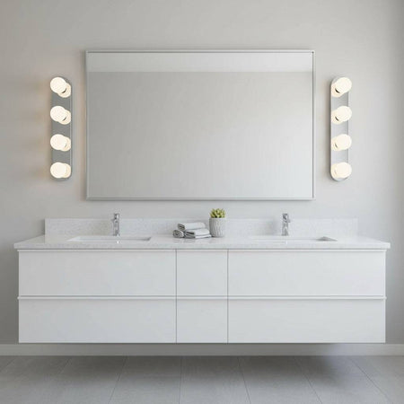 silver vanity light for bathroom mirror mounted either side of a mirror in a modern bathroom