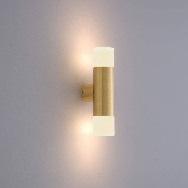 brass up and down exterior light shown on a white wall 