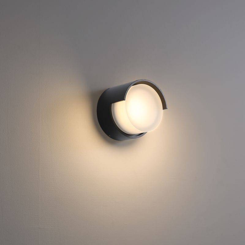 black outside wall lamp mounted on a white wall 