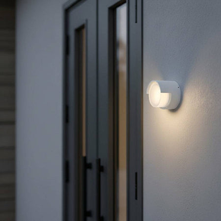 white garden wall light mounted outside a modern home next to the front door area