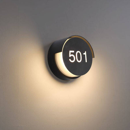 LED hotel room number sign mounted on a white background