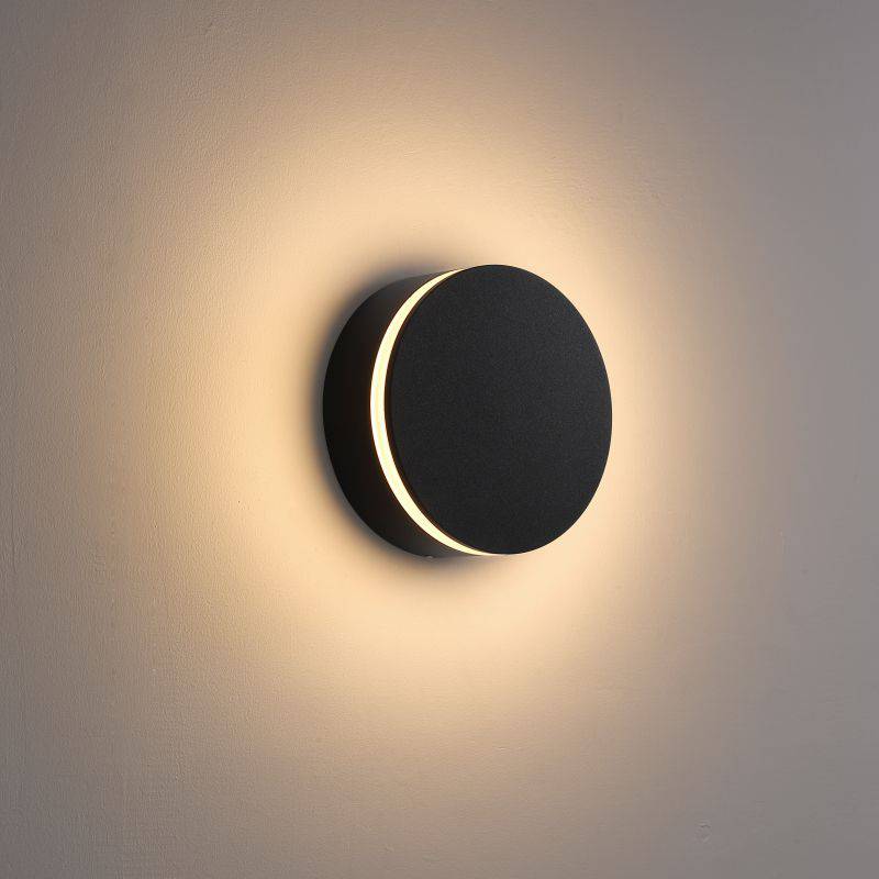black LED outdoor wall lamp shown mounted on a white wall 
