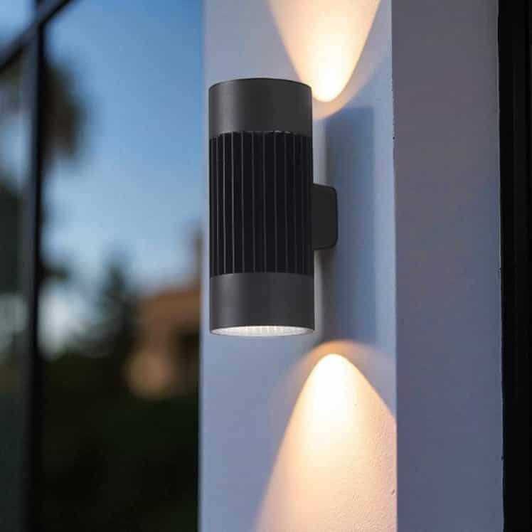 large exterior wall light mounted on a white column outside a building