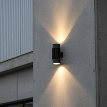large exterior wall light mounted on a concrete wall outside a large commercial building