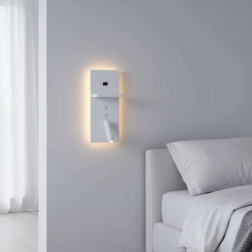 white bedroom wall light with reading light mounted on the wall next to the bed in a white room