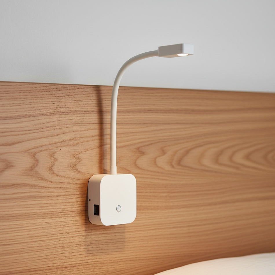 flexible white bedroom reading lamp with USB ports mounted on a wooden bed headboard