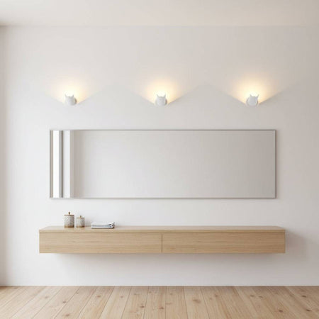 White wall uplighter indoor above a dressing table on  a grey wall in a modern home