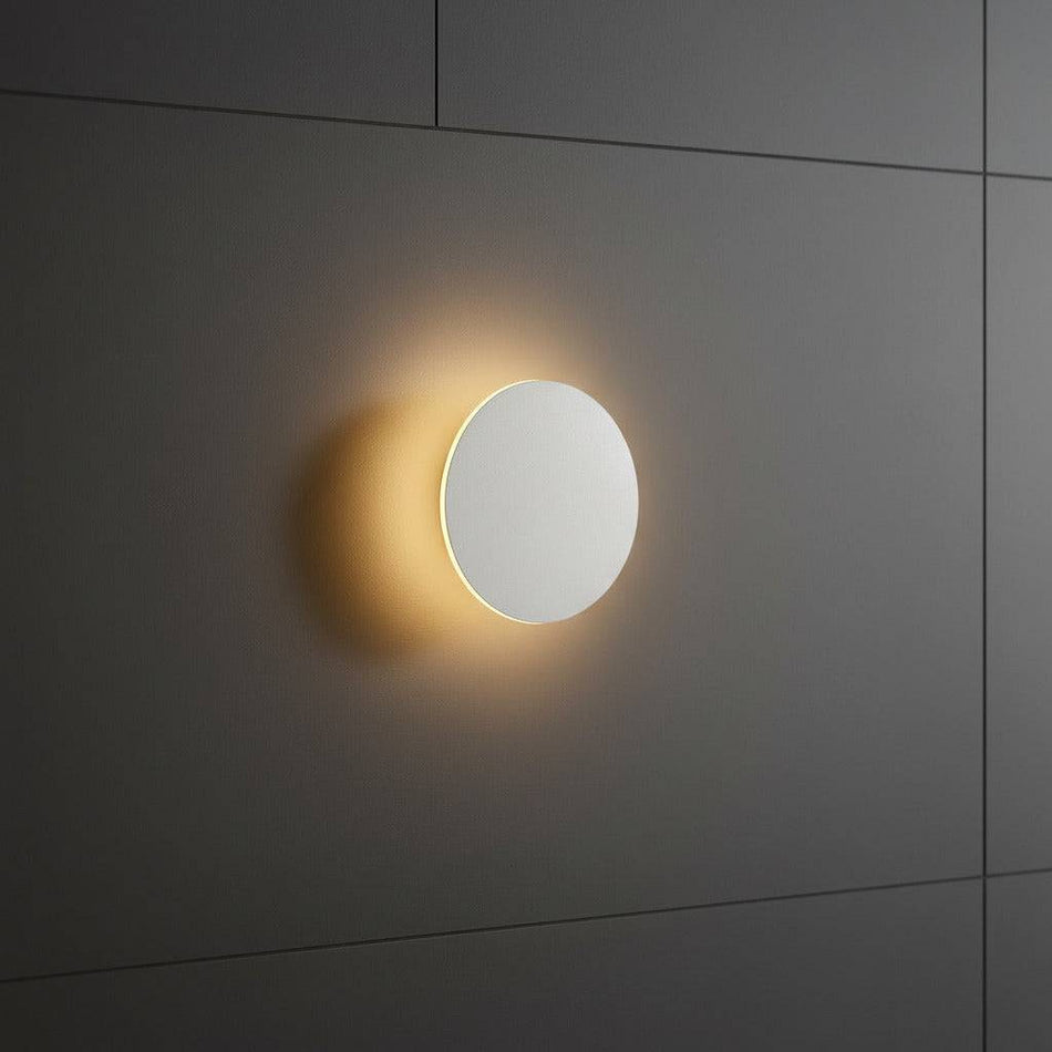 white modern bathroom wall sconce mounted on a tiled bathroom wall 