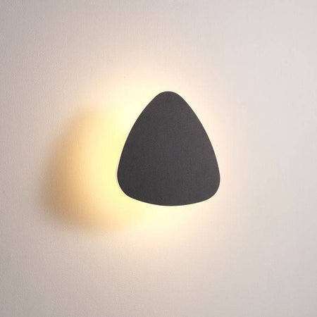 black bathroom sconce light shown fitted on a white wall 