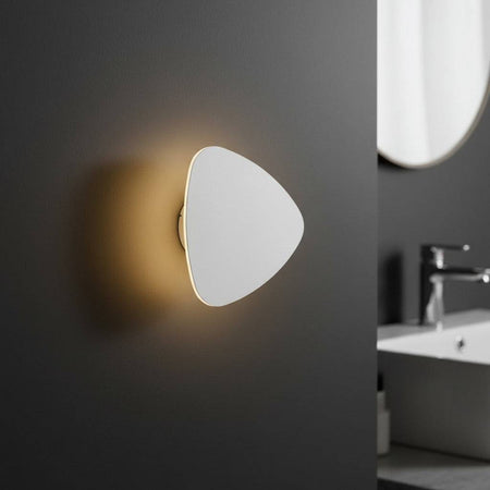 white wall mounted vanity light mounted on the wall in a modern bathroom