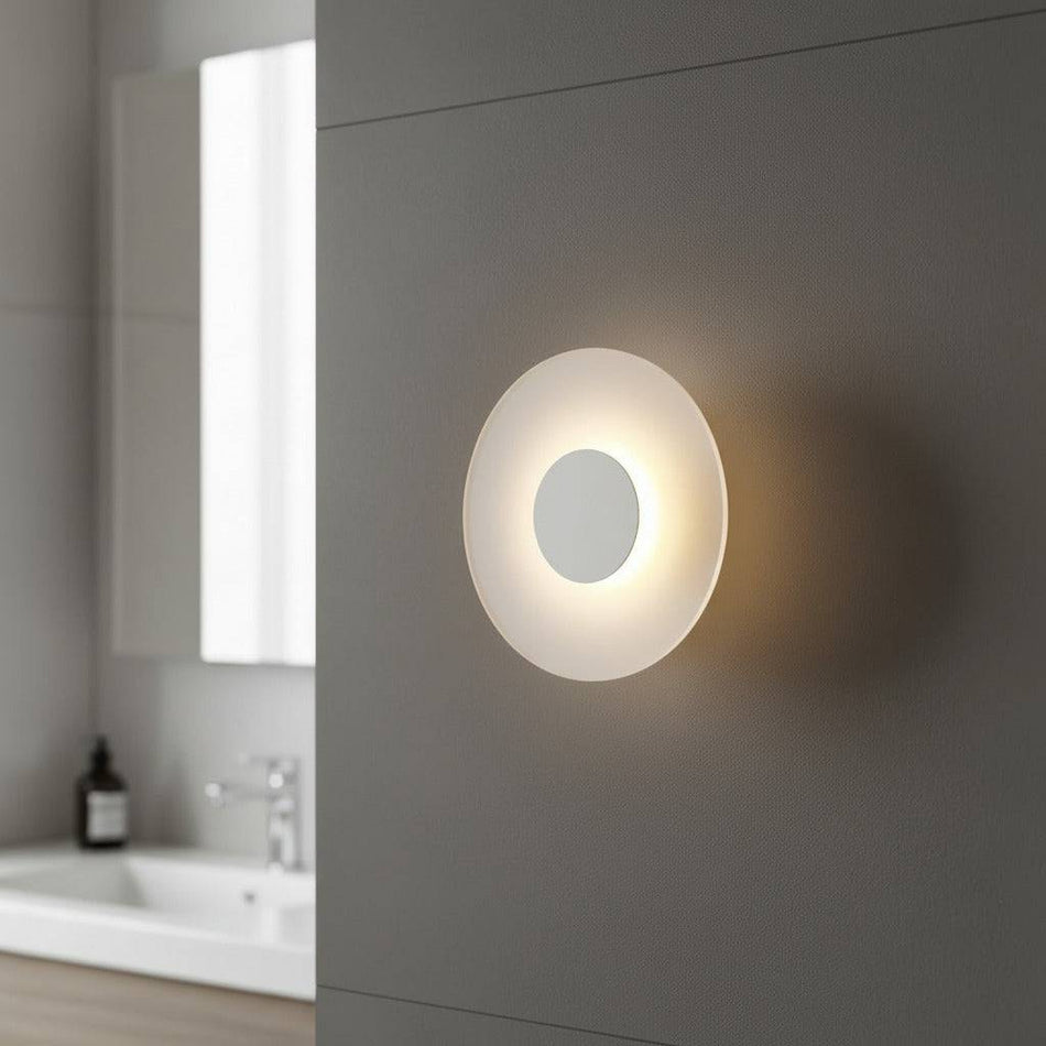 white IP65 bathroom wall sconce mounted on the wall in a modern bathroom 