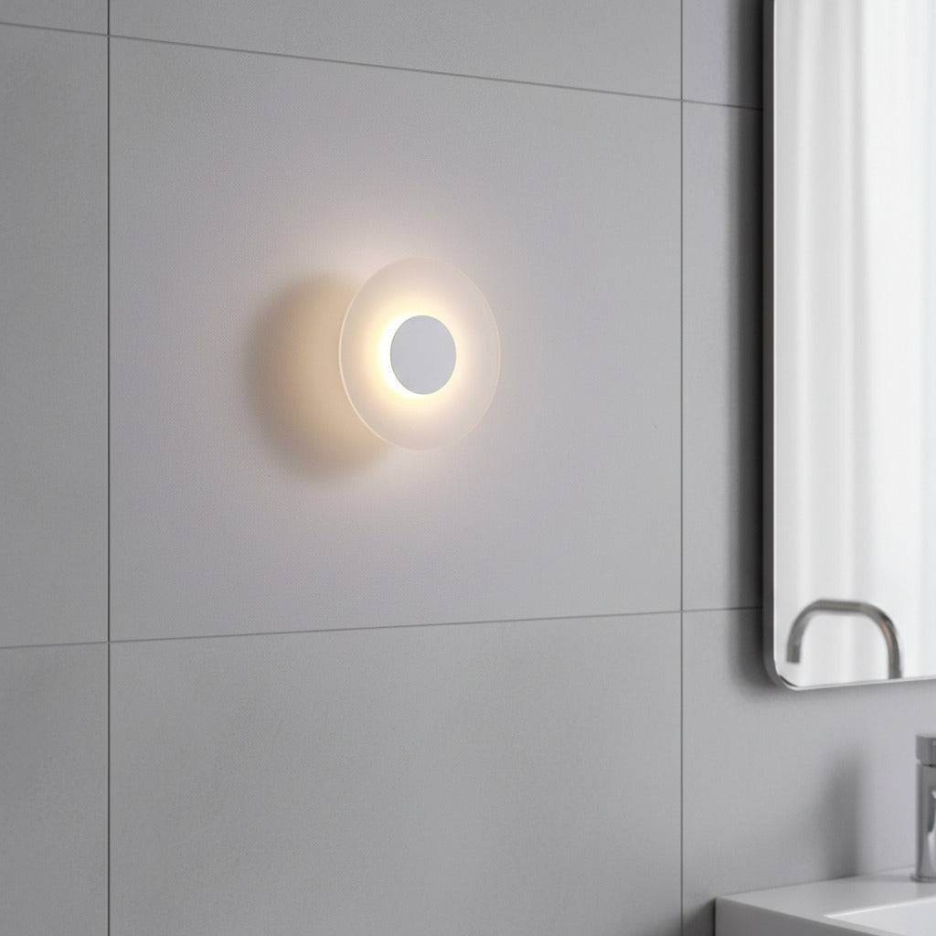 white IP65 bathroom wall sconce mounted on tiles on a modern bathroom wall 