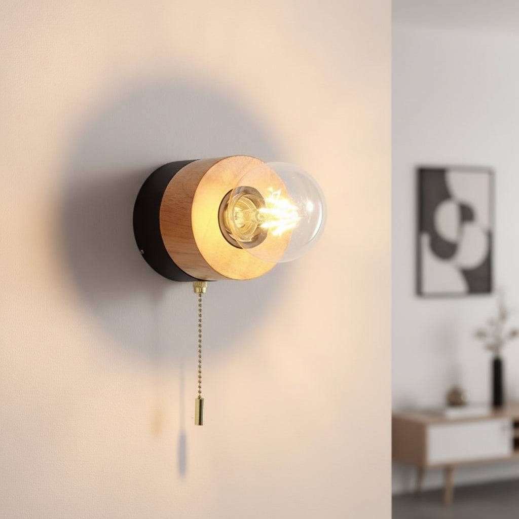 Black wall light indoor with pull cord on a white background in a lounge