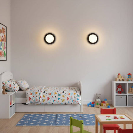 Black and white modern interior wall light on a wall in a children's bedroom