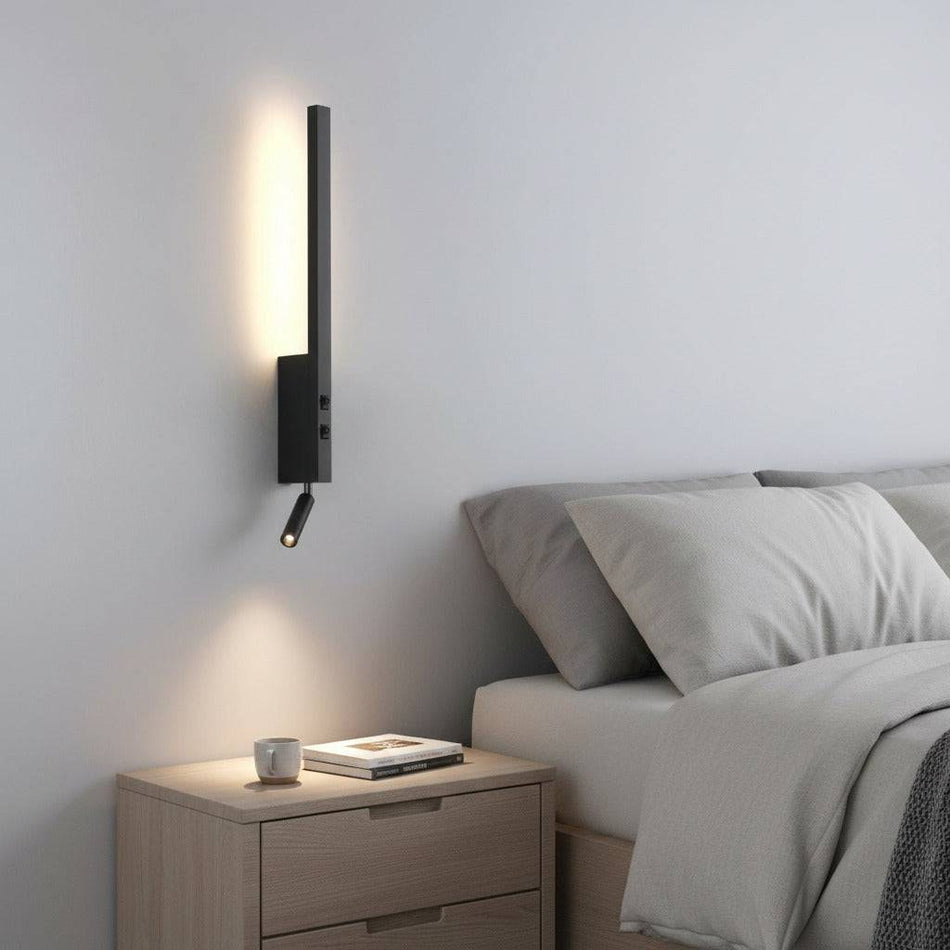 black bedside light with reading light installed in a modern bedroom next to the bed