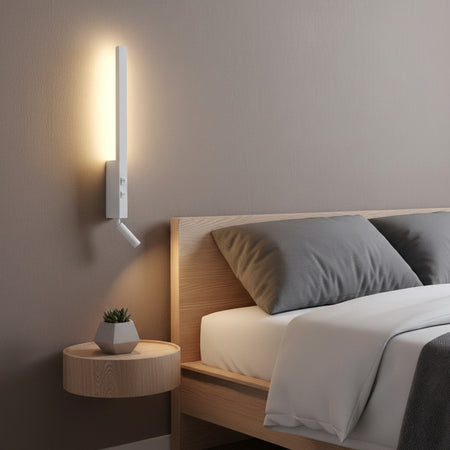 white bedside wall light with reading light mounted next to a bed on the wall 