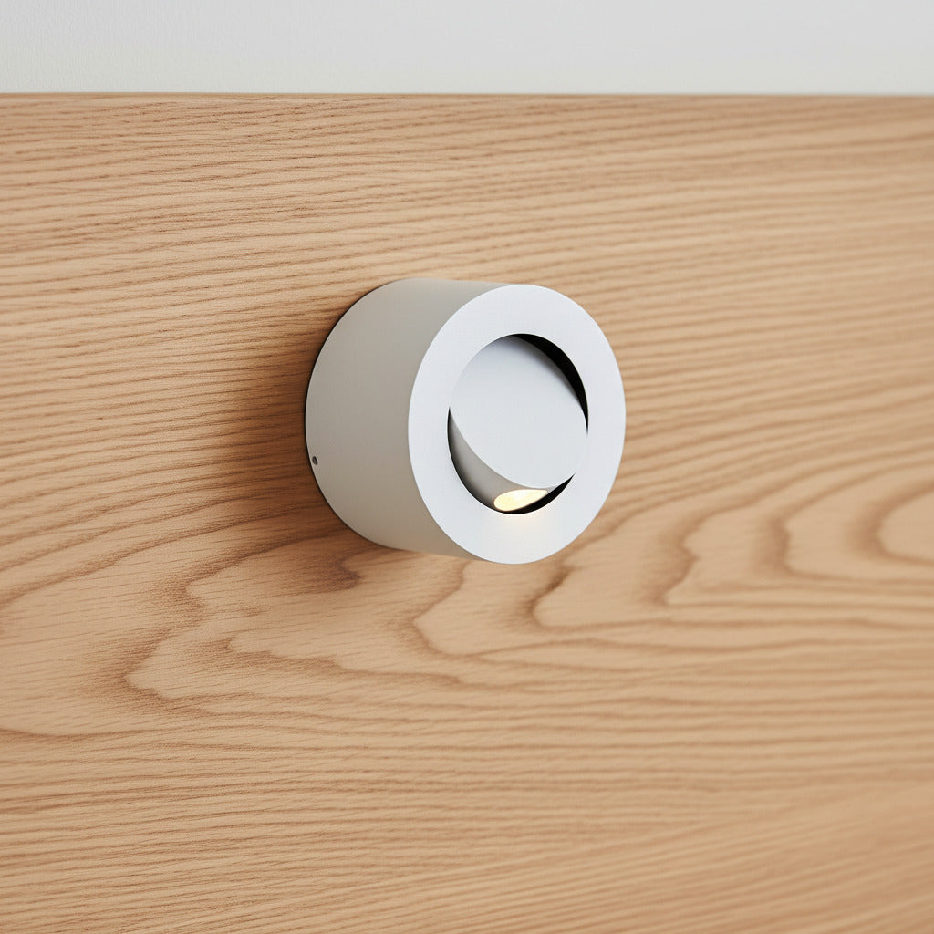white adjustable bed lamp for reading mounted on a wooden bed headboard