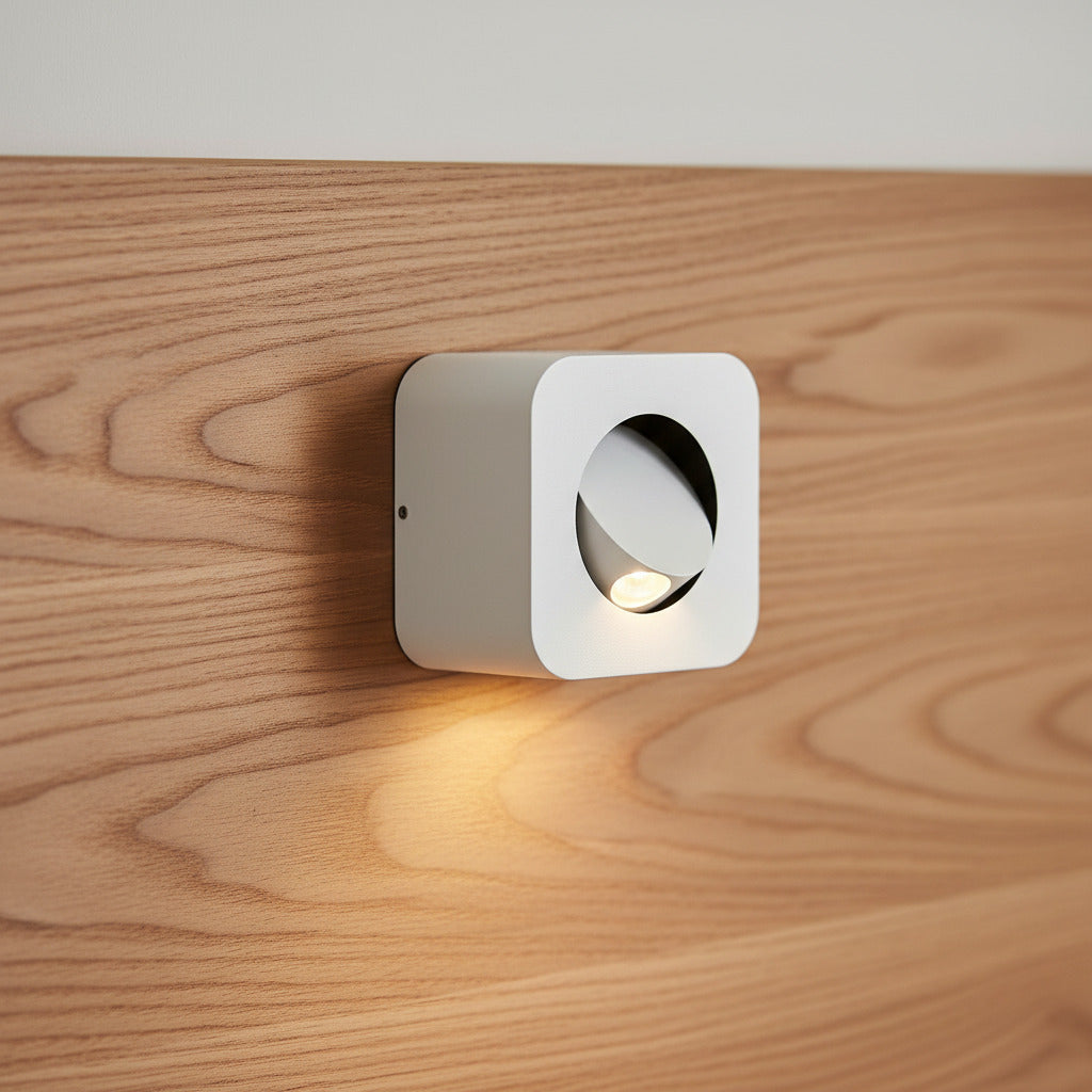 white adjustable wall mounted bedside lamp fitted on a wooden headboard