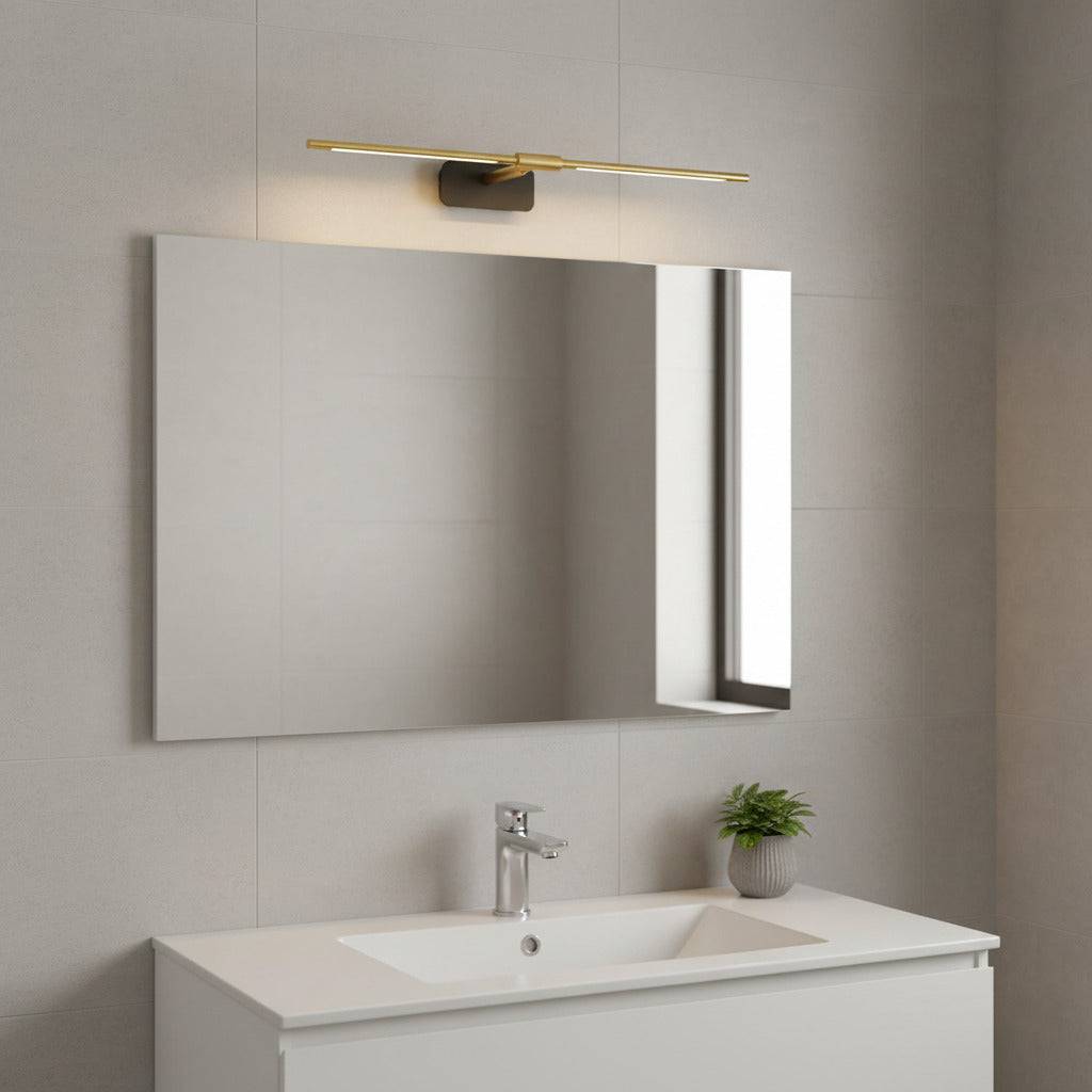 gold wall mirror LED light mounted over a bathroom mirror in a modern bathroom