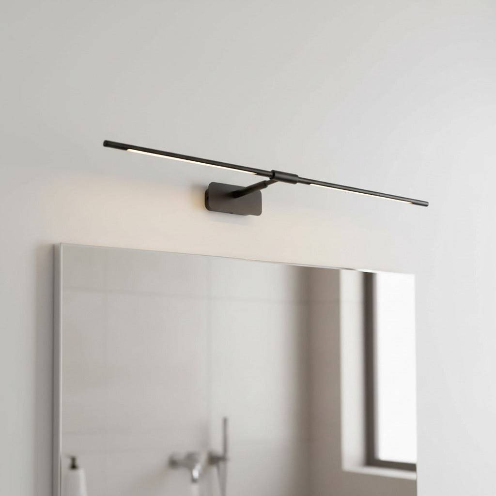 black cabinet mirror light mounted over a mirror in a modern bathroom