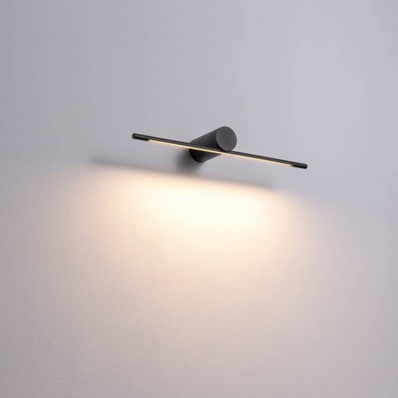 black picture light shown mounted on a grey wall