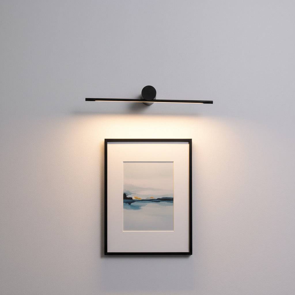 black picture light shown mounted on the wall over a picture