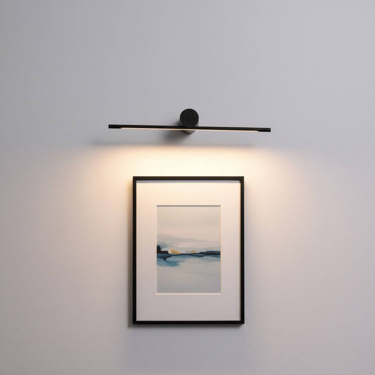 black picture light shown mounted on the wall over a picture