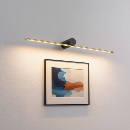 gold led picture lamp mounted on the wall above a modern picture