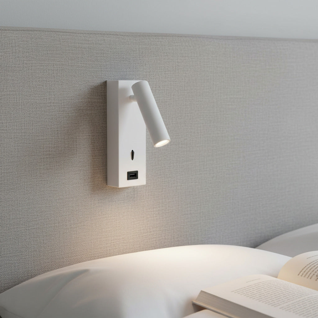 white wall mounted reading lamp with USB port fitted to a fabric headboard