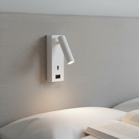 white wall mounted reading lamp with USB port fitted to a fabric headboard