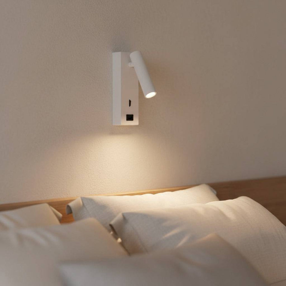 white wall mounted reading light with USB port mounted in a modern bedroom on the wall 