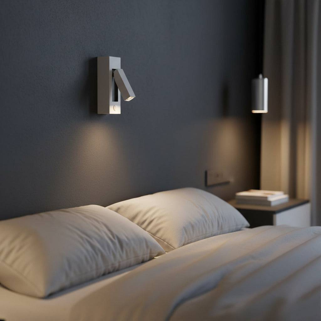 white wal mounted reading light mounted over a bed in a modern bedroom 