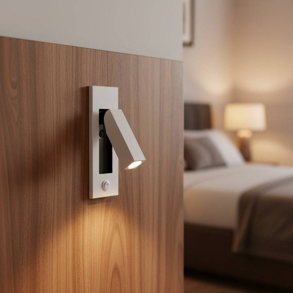 white recessed bedroom reading lamp mounted on a wall in a hotel room