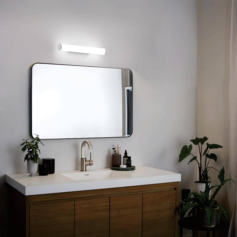 white bathroom mirror wall light mounted over the top of a bathroom mirror