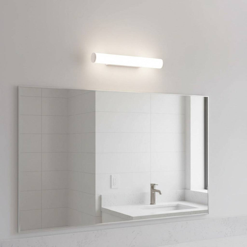 white bathroom mirror wall light mounted over a mirror in a neutral coloured bathroom