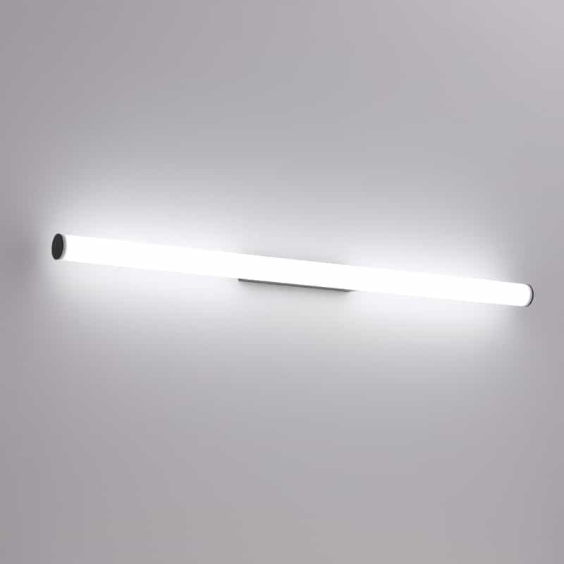 black tubular bathroom sconce mounted on a white wall 